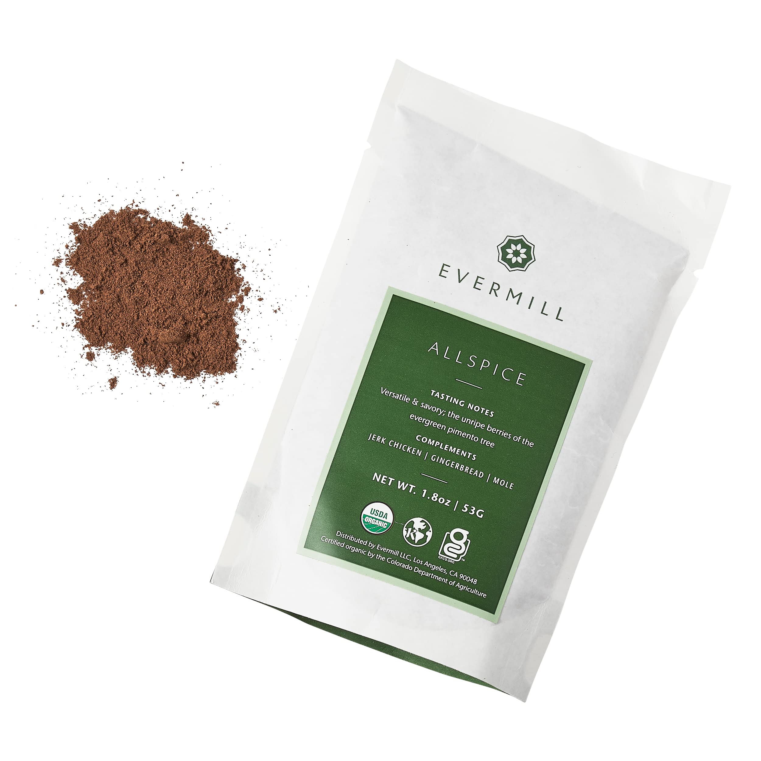 A white packet of Evermill Organic Allspice Refill, made from dried berries of the West Indies, lies on a white background. To its left, there is a small pile of ground allspice. The packet has a green label with tasting notes and mentions it is USDA organic. The net weight is 1.8 oz or 53 grams.